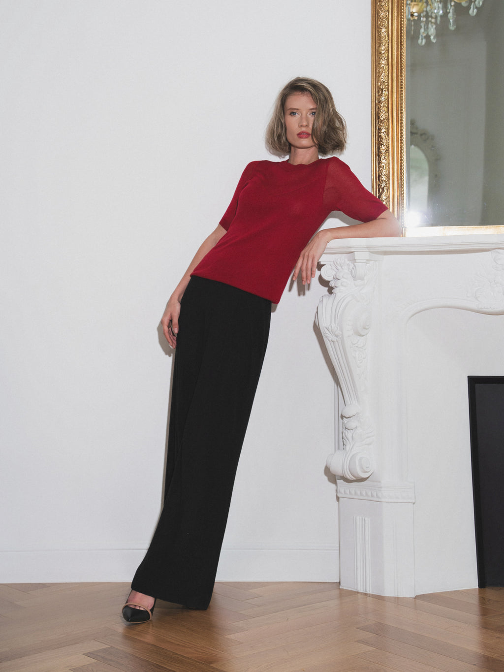 Burgundy fitted knit short sleeved top with a sheer neckline 