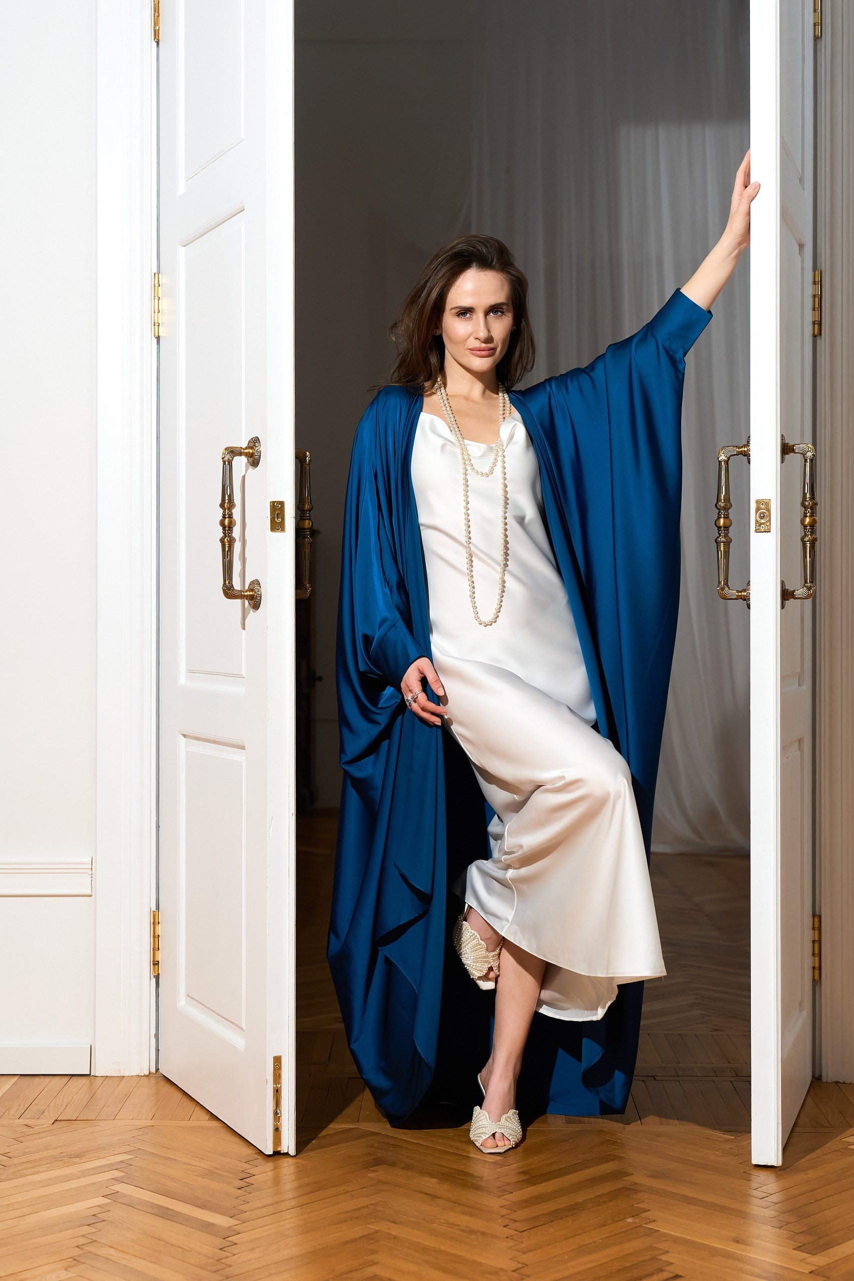 Silk abaya cape in Deep Blue color from the front lifestyle 