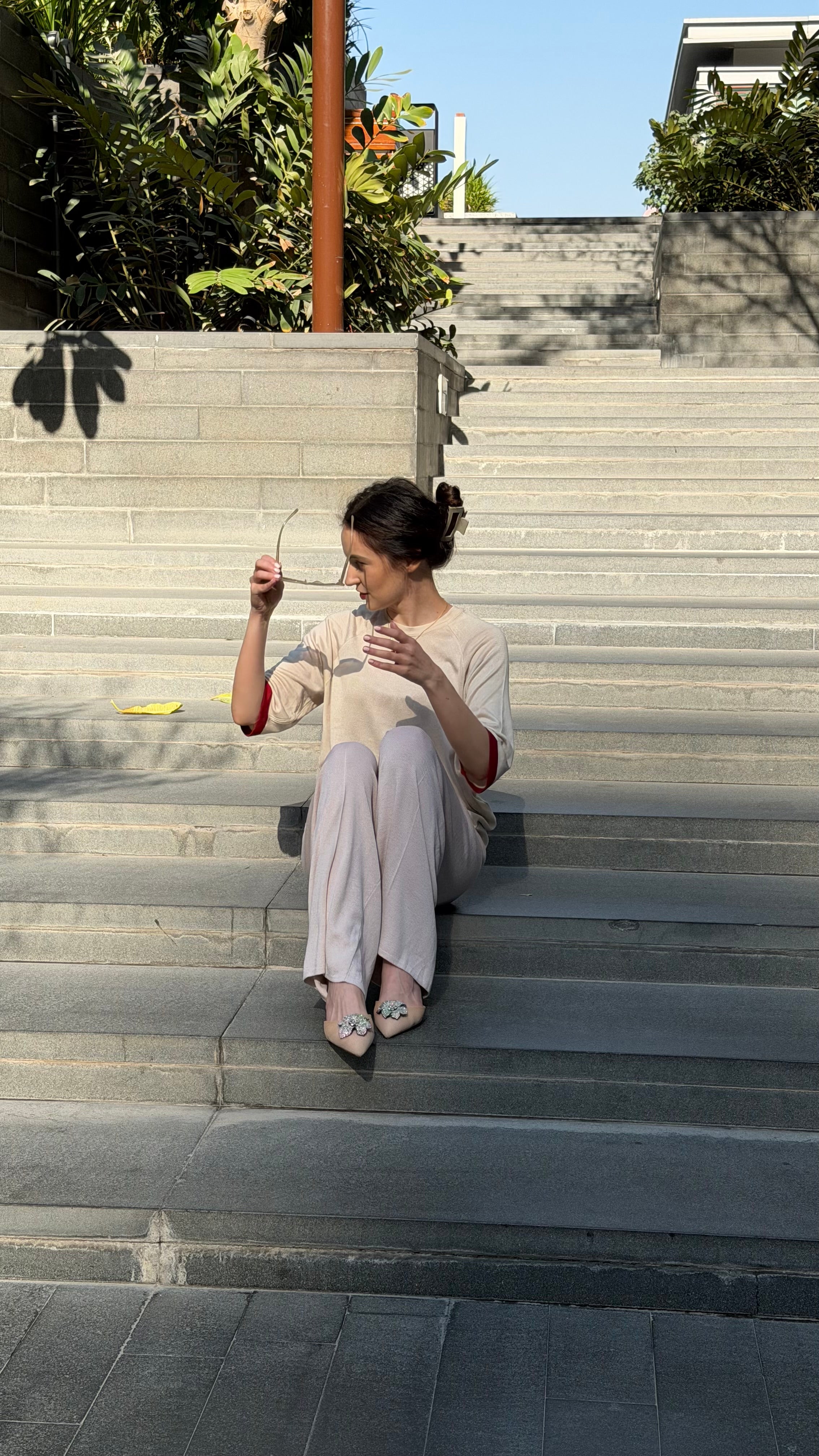 Ivory wide-leg knit trousers with relaxed fit and soft drape