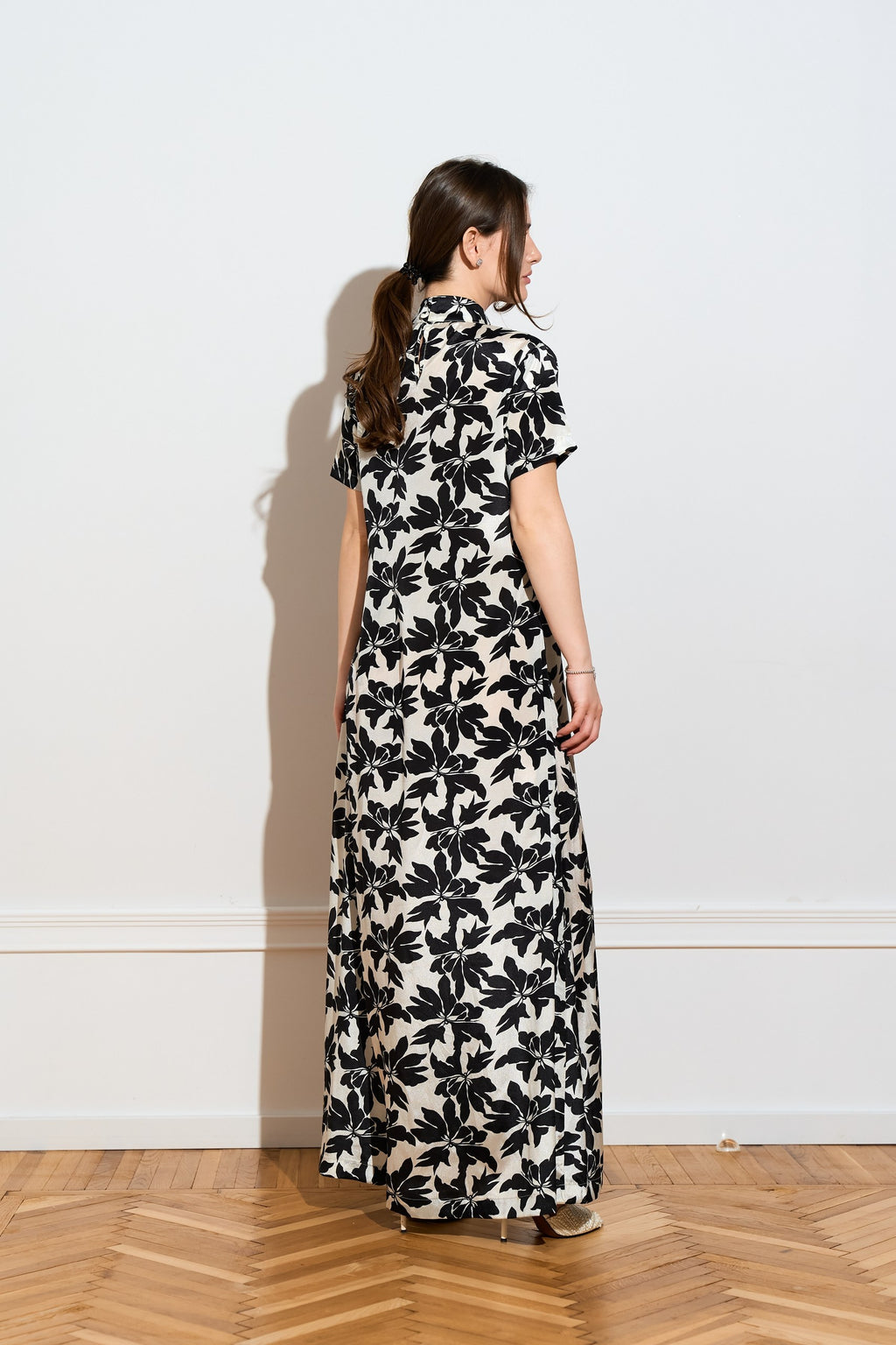 A silk Black & White floral maxi dress from the side 