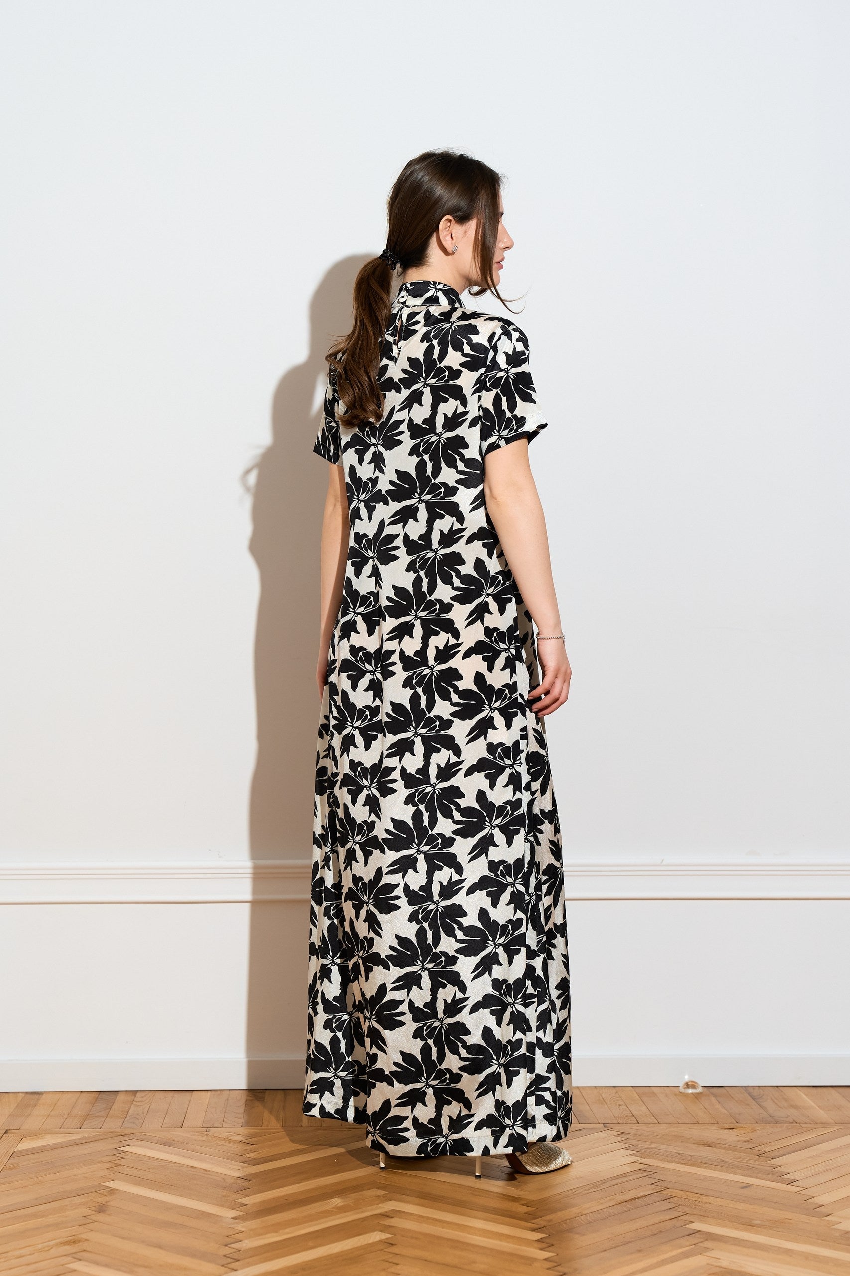 A silk Black & White floral maxi dress from the side 