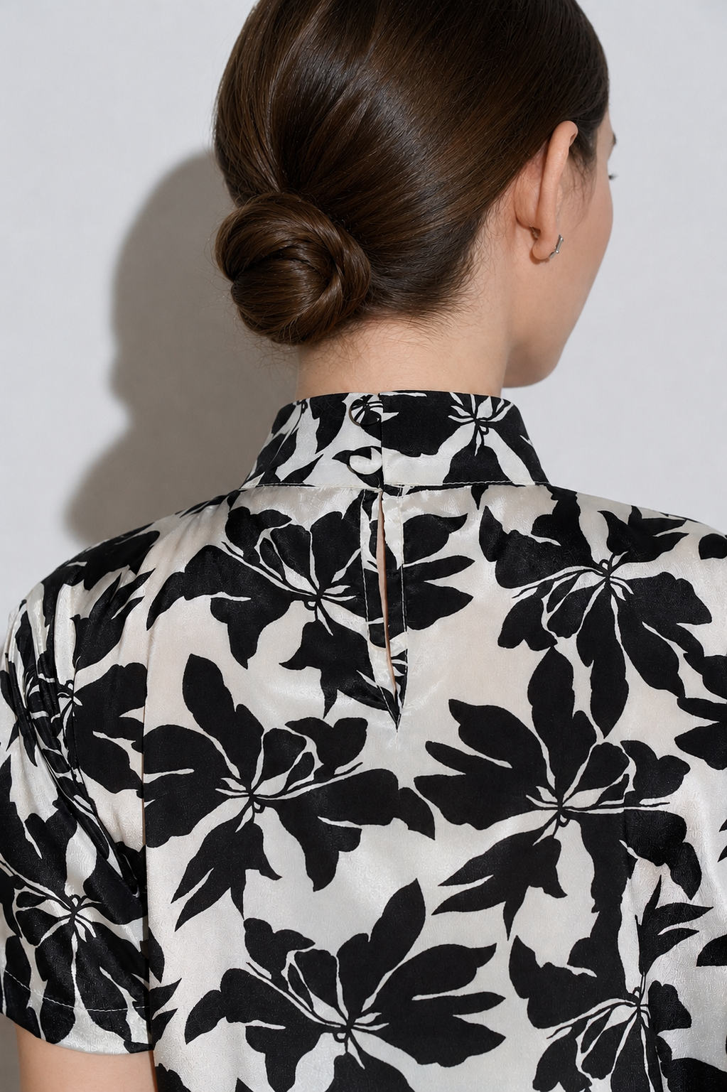 A silk Black & White floral maxi dress close up detail of the buttons