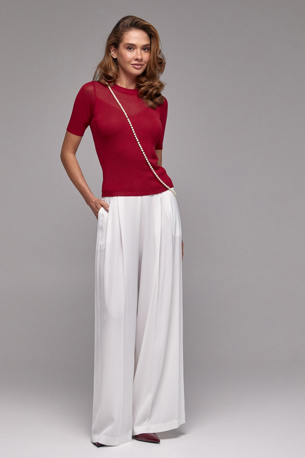 Burgundy fitted knit top with subtle lighter-knit neckline detail